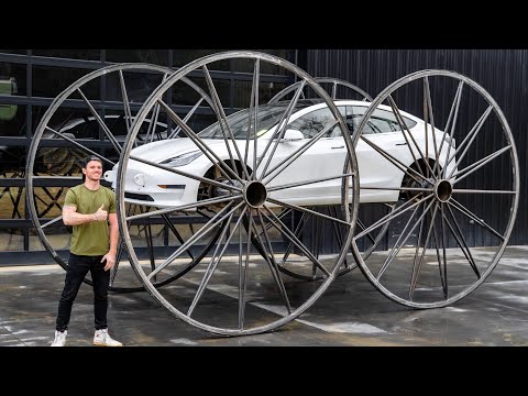 Driving A Tesla Upside-Down (10ft Tall Wheels)